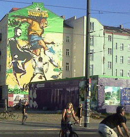 Berlin street with world up mural